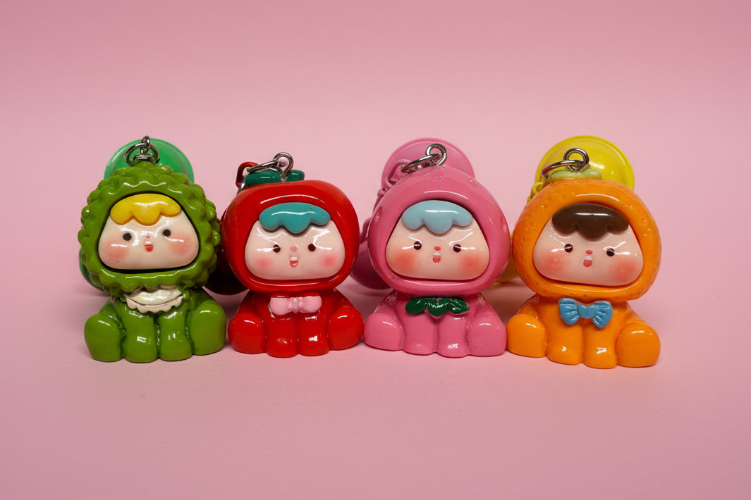 Nyckelring med bjällra och bebis i söta dräkter