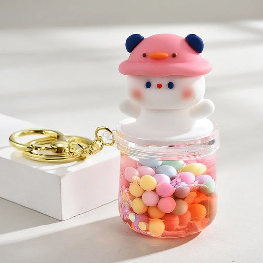 Nyckelring kawaii nalle med rosa hatt och skakbar burk med kulor