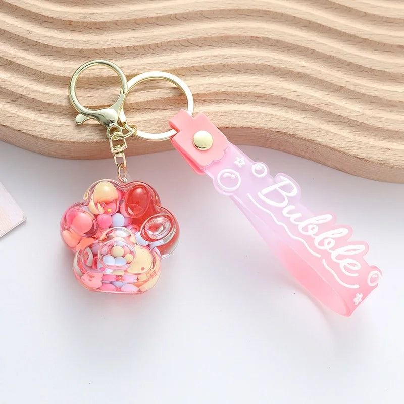 Vätskefylld Tass Nyckelring - Söt Kawaii Design med Färgglada Kulor för Väskor